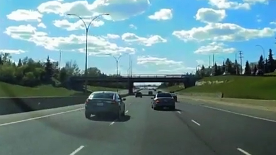 Dash cam footage captures two vehicles racing in Canada