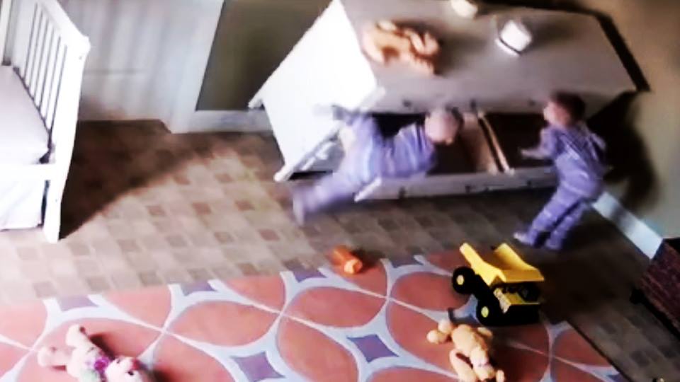 Watch what this 2-year old boy does when his twin is trapped