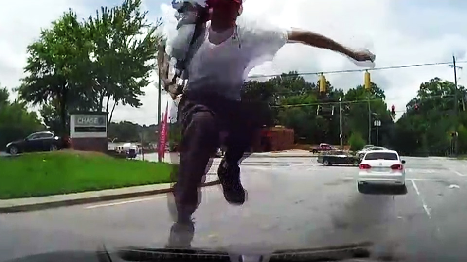 Caught on Dashcam: Man stomps woman's windshield