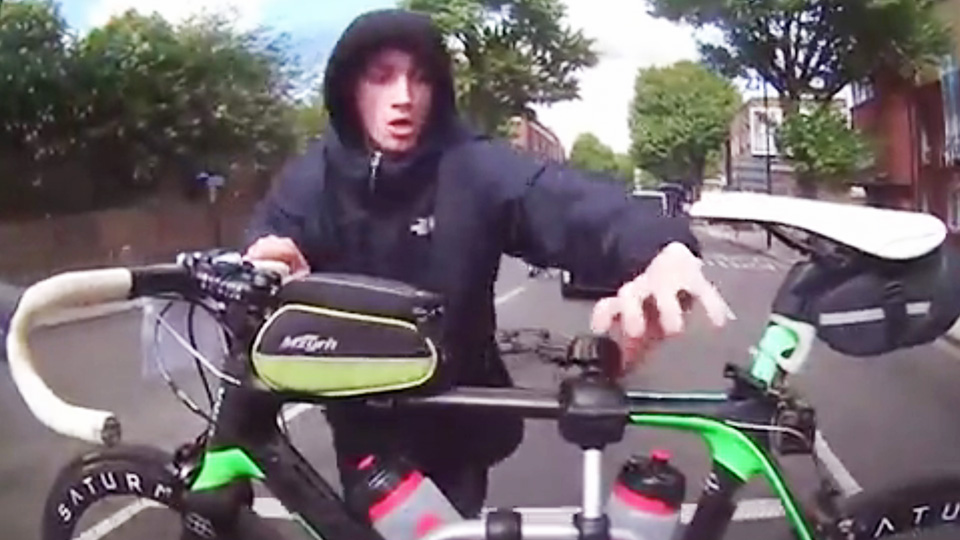 A hooligan caught on dashcam trying to steal a racing bike in central London 